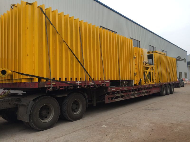 The massive heavy-duty vacuum pre-cooler loaded onto a specialized flatbed truck, ready for deployment to the client's agricultural base. The massive heavy-duty vacuum pre-cooler loaded onto a specialized flatbed truck, ready for deployment to the client's agricultural base.