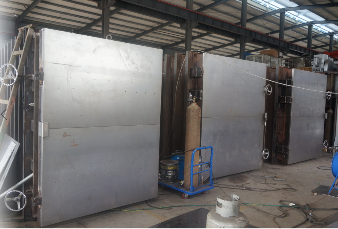 Heavy-duty stainless steel vacuum chambers undergoing precise welding and assembly at the Ganzhou Dachang manufacturing facility.